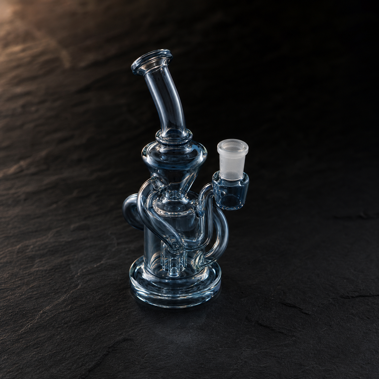 Dab rigs and concentrate tools — premium glass on slate