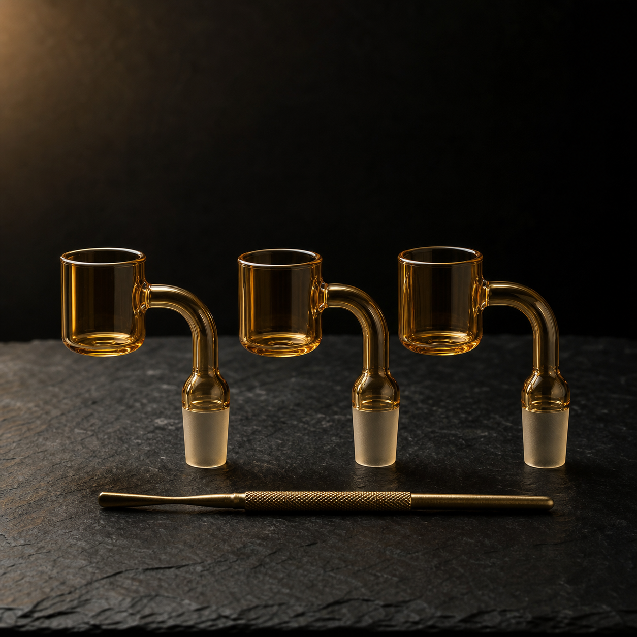 Quartz bangers and dab nails on slate with brass dab tool